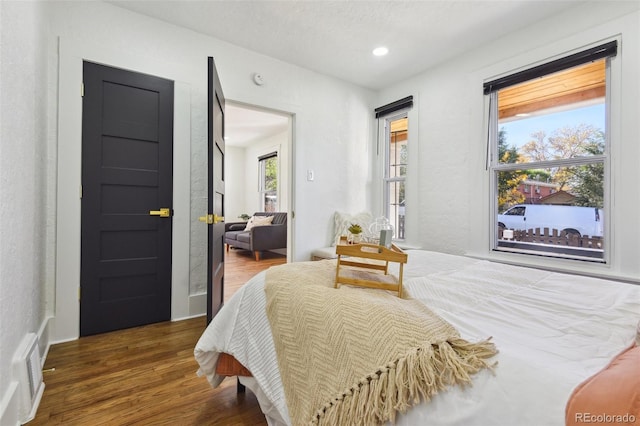 bedroom featuring dark hardwood / wood-style floors