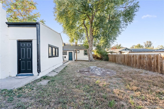 view of yard with an outdoor fire pit