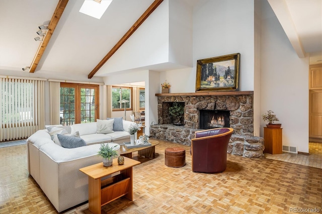 4936 Clubhouse Cir, Boulder, CO 80301 - living area with high vaulted ceiling, a fireplace, beam ceiling, and a skylight