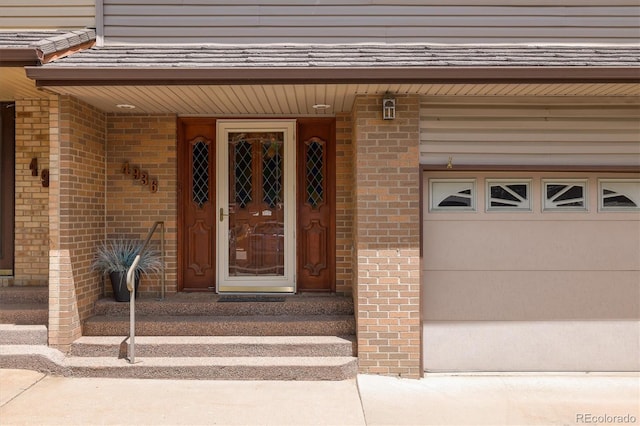 4936 Clubhouse Cir, Boulder, CO 80301 - doorway to property featuring a garage and brick siding