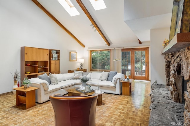 4936 Clubhouse Cir, Boulder, CO 80301 - living area with high vaulted ceiling, a skylight, beam ceiling, and a stone fireplace