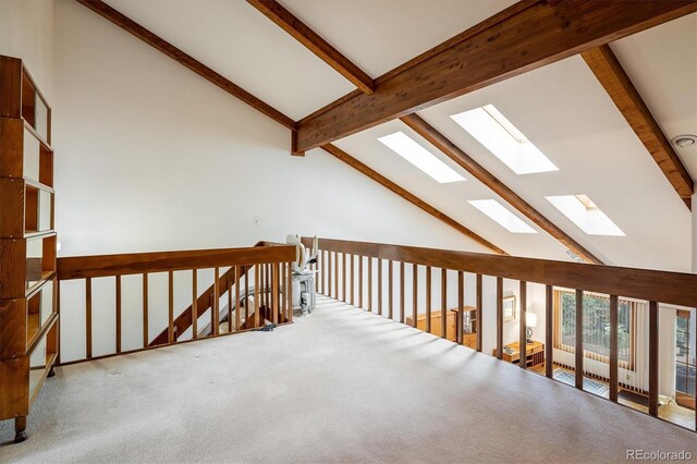 4936 Clubhouse Cir, Boulder, CO 80301 - hallway featuring a skylight, beamed ceiling, carpet, high vaulted ceiling, and an upstairs landing
