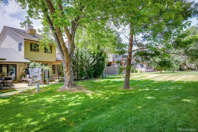 4936 Clubhouse Cir, Boulder, CO 80301 - view of green lawn with a patio area