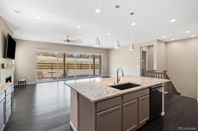 6725 Mentha Dr, Castle Rock, CO 80108 - kitchen with visible vents, a sink, gray cabinetry, open floor plan, and dishwashing machine