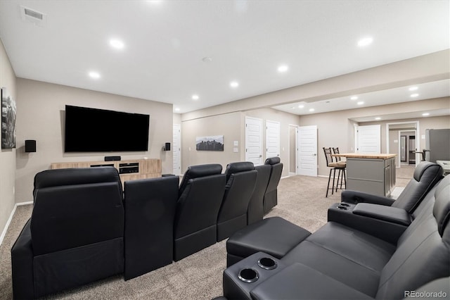 6725 Mentha Dr, Castle Rock, CO 80108 - cinema room featuring light colored carpet, recessed lighting, baseboards, and visible vents