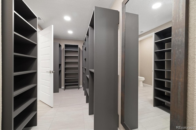 6725 Mentha Dr, Castle Rock, CO 80108 - walk in closet featuring light tile patterned flooring