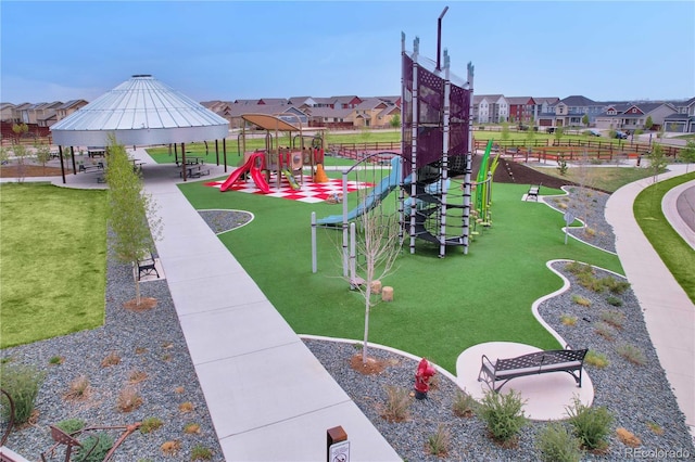 1867 Abundance Dr, Windsor, CO 80550 - community play area with a yard, a gazebo, and a residential view