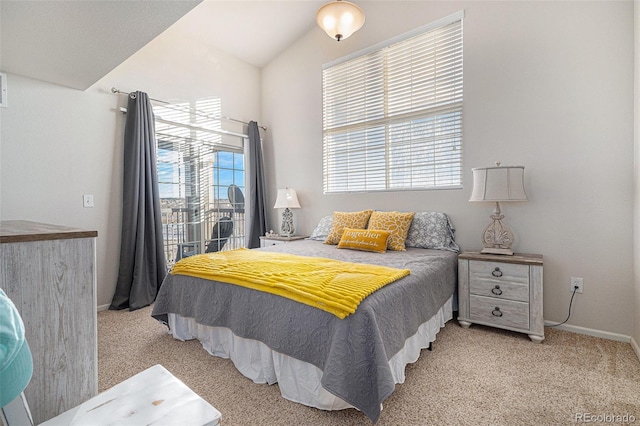 carpeted bedroom featuring lofted ceiling and access to outside