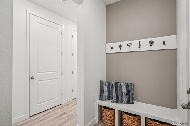 12841 Lake Port St, Longmont, CO 80504 - mudroom featuring light wood finished floors and baseboards