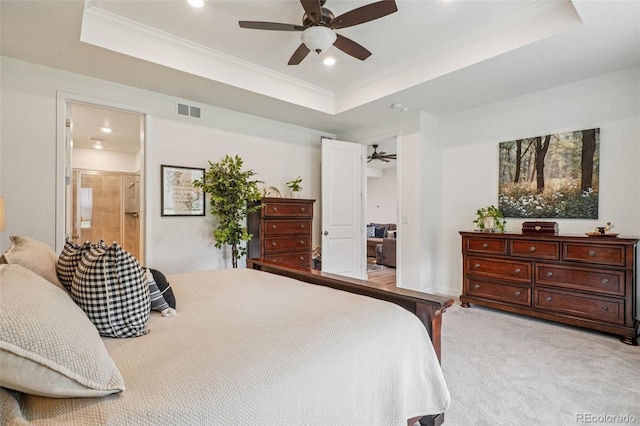 12841 Lake Port St, Longmont, CO 80504 - bedroom with a tray ceiling, ornamental molding, recessed lighting, light colored carpet, and ensuite bathroom