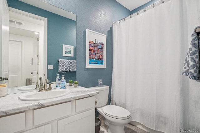 12841 Lake Port St, Longmont, CO 80504 - bathroom with vanity, a textured wall, and a shower with curtain