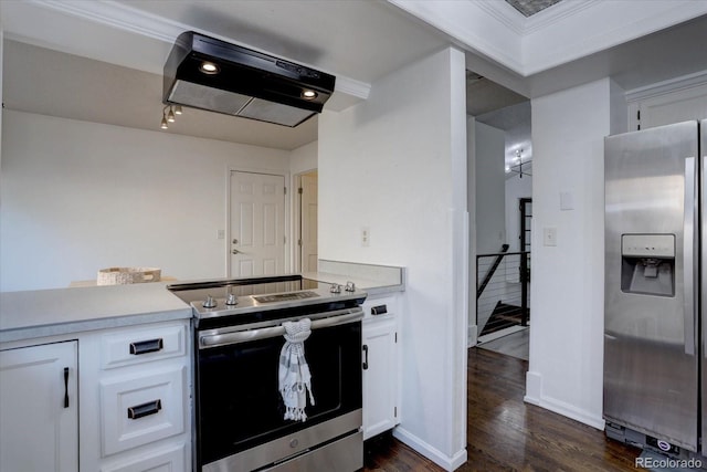 kitchen with white cabinets, baseboards, light countertops, dark wood finished floors, and stainless steel appliances