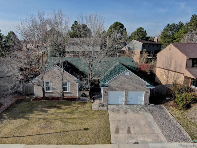 view of front of house featuring a front lawn and concrete driveway