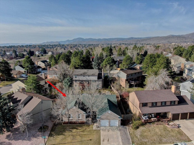 birds eye view of property with a mountain view and a residential view