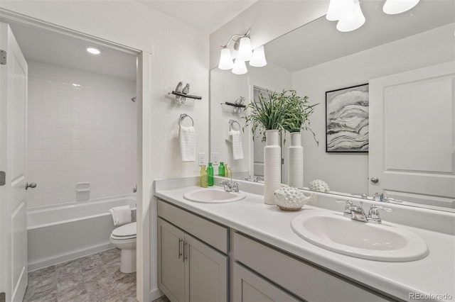 full bathroom with washtub / shower combination, toilet, and vanity