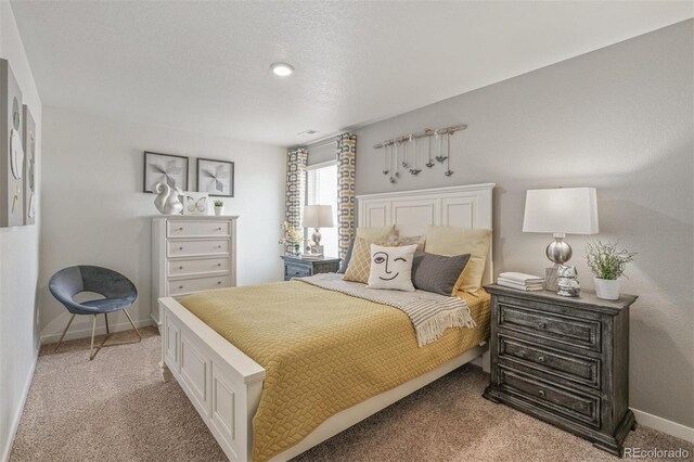 bedroom with light colored carpet