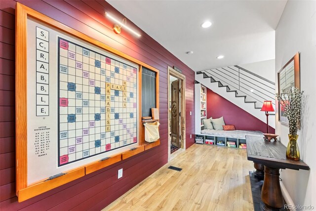hallway with visible vents, stairway, recessed lighting, and wood finished floors