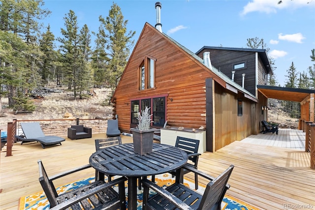 wooden deck with outdoor dining area