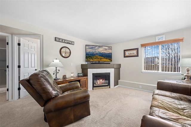 carpeted living room featuring lofted ceiling and a tiled fireplace