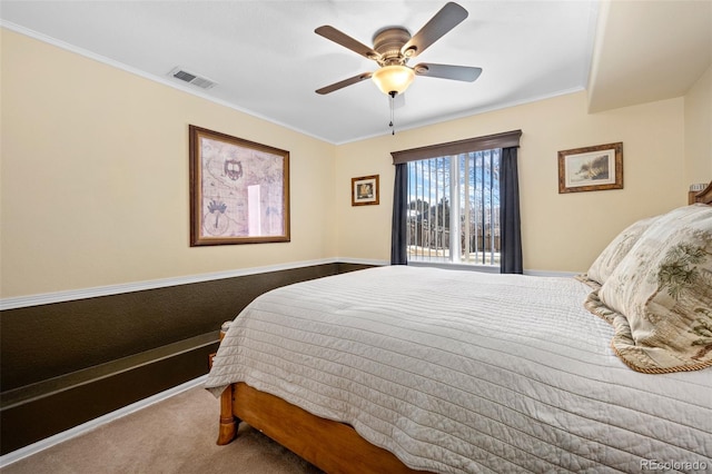 bedroom with crown molding, carpet floors, and ceiling fan