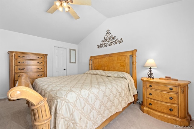 bedroom featuring lofted ceiling, light colored carpet, and ceiling fan