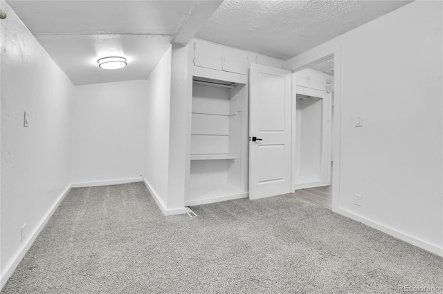 walk in closet with carpet floors