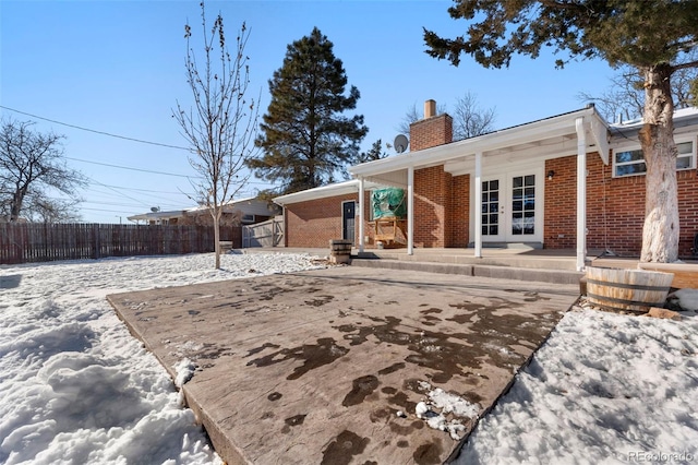 back of property featuring french doors