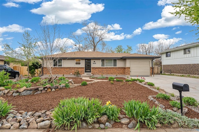 1772 S Pierce St, Lakewood, CO 80232 - ranch-style house with brick siding, a garage, fence, and driveway