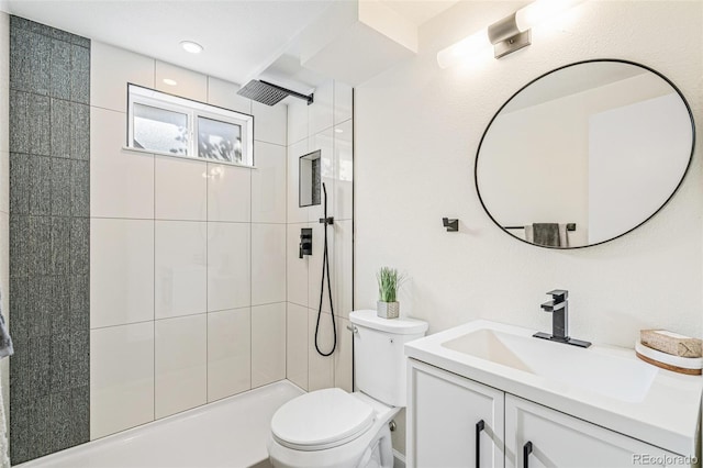 1772 S Pierce St, Lakewood, CO 80232 - bathroom with vanity, toilet, and tiled shower