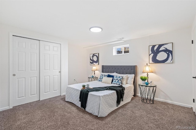 1772 S Pierce St, Lakewood, CO 80232 - bedroom featuring baseboards, carpet, a closet, and visible vents