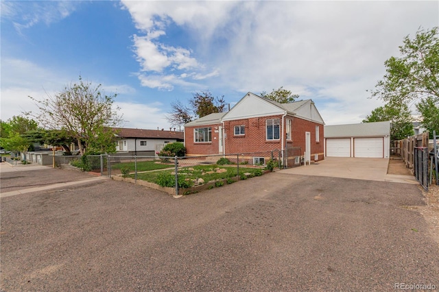 8110 Ivy St, Dupont, CO 80024 - view of front facade with brick siding and a detached garage