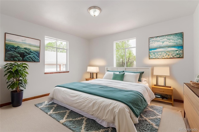 8110 Ivy St, Dupont, CO 80024 - bedroom featuring carpet flooring, multiple windows, and baseboards