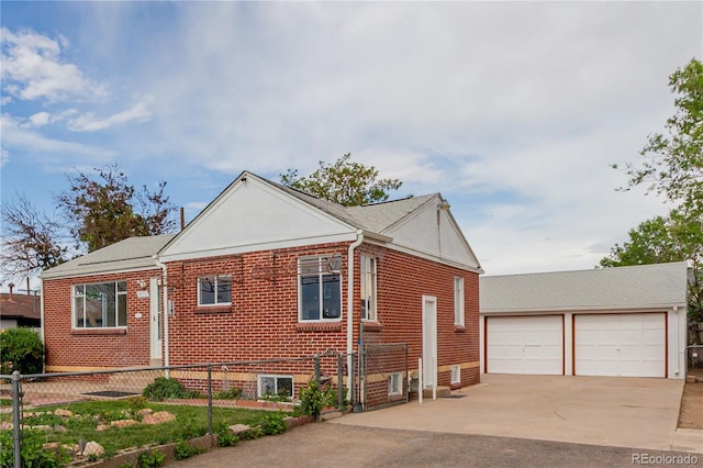 8110 Ivy St, Dupont, CO 80024 - view of side of property featuring an outdoor structure, a garage, and brick siding