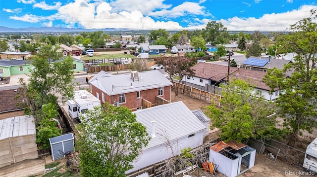 8110 Ivy St, Dupont, CO 80024 - aerial view of residential area with mountains