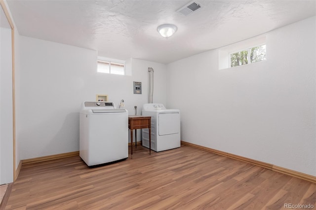 8110 Ivy St, Dupont, CO 80024 - washroom featuring independent washer and dryer, light wood-style floors, baseboards, and plenty of natural light