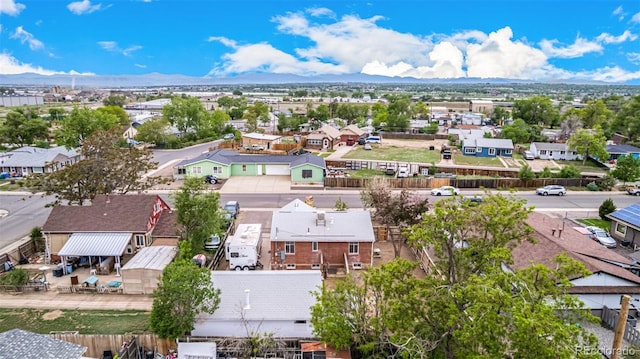 8110 Ivy St, Dupont, CO 80024 - aerial perspective of suburban area featuring a mountainous background