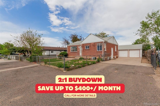 8110 Ivy St, Commerce City, CO 80022 - view of front of house featuring brick siding, a garage, and an outdoor structure
