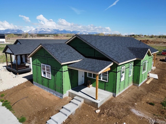 10602 Engelmann Ave, Salida, CO 81201 - property under construction featuring roof with shingles, covered porch, and a mountain view