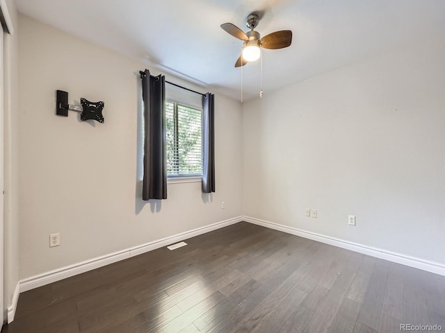 6447 St Vrain Ranch Blvd, Longmont, CO 80504 - unfurnished room with dark wood-style floors, ceiling fan, and baseboards