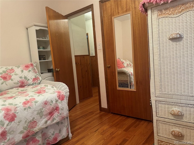 bedroom with wood-type flooring