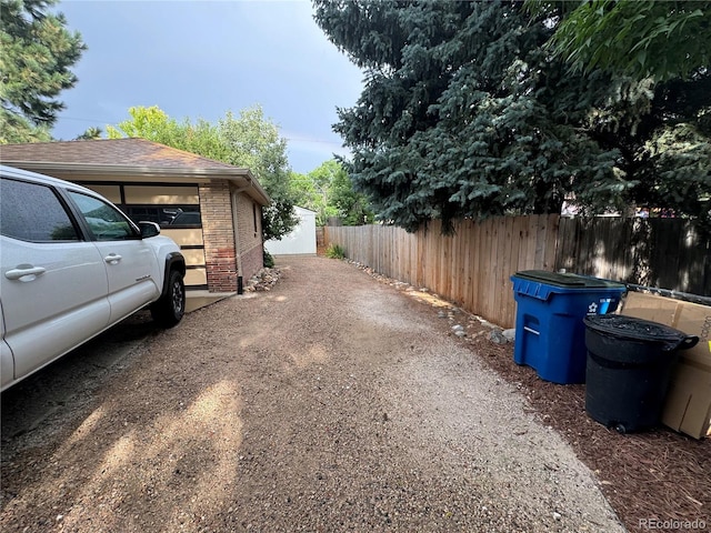 view of side of home with an outbuilding and a garage