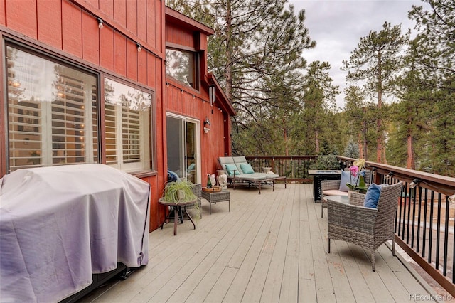 wooden deck featuring area for grilling