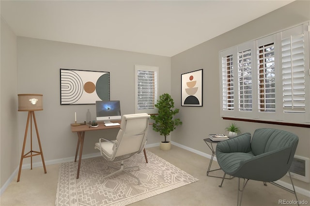 carpeted office space featuring visible vents and baseboards