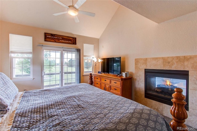 895 Antelope Dr W, Bennett, CO 80102 - bedroom featuring lofted ceiling, a tiled fireplace, and ceiling fan