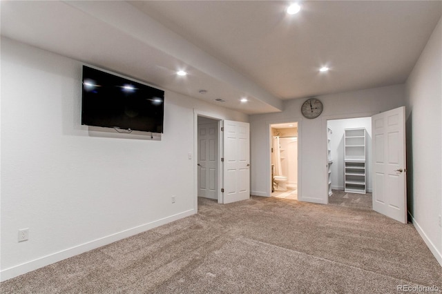 895 Antelope Dr W, Bennett, CO 80102 - unfurnished bedroom with carpet floors, recessed lighting, a walk in closet, baseboards, and ensuite bath