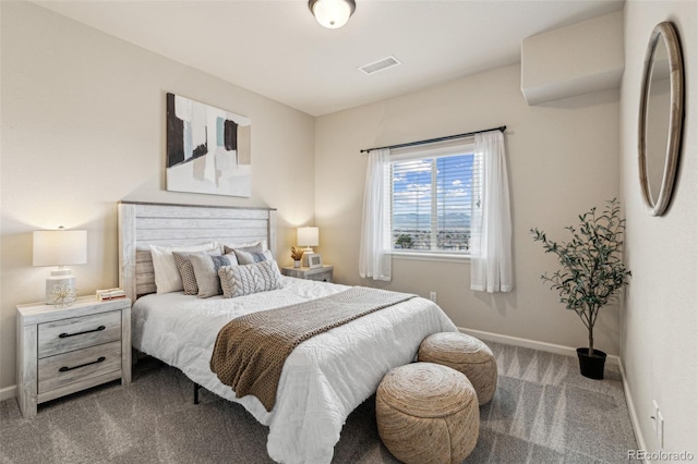 carpeted bedroom featuring visible vents, baseboards, and fridge