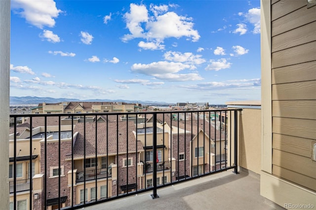 balcony featuring a mountain view and a residential view