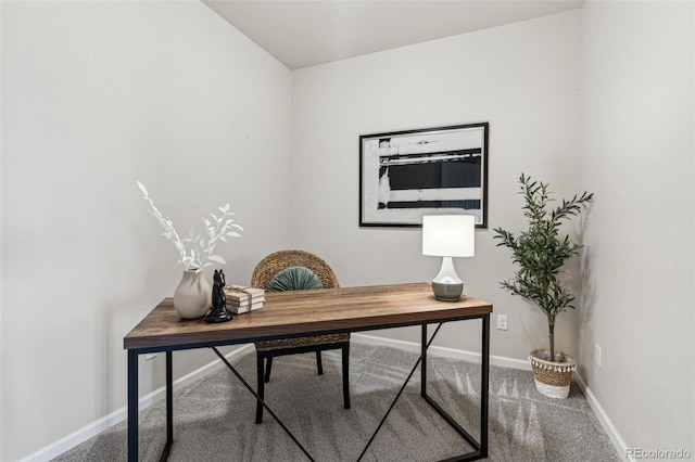 carpeted office featuring baseboards