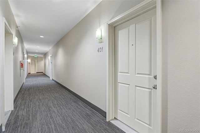 corridor with recessed lighting, carpet flooring, and baseboards