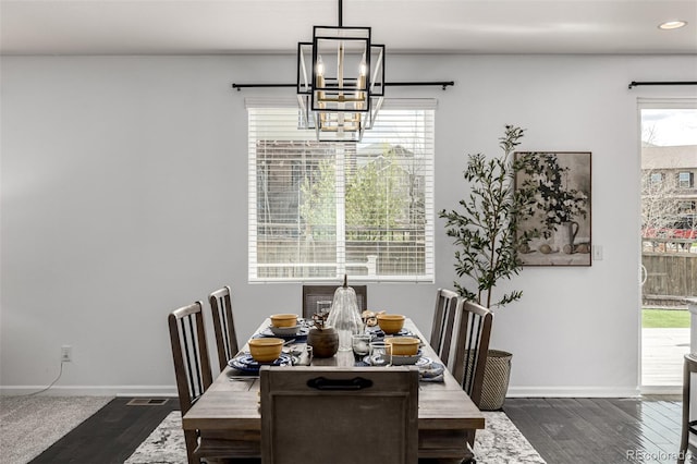 dining area featuring a chandelier, baseboards, healthy amount of natural light, and recessed lighting